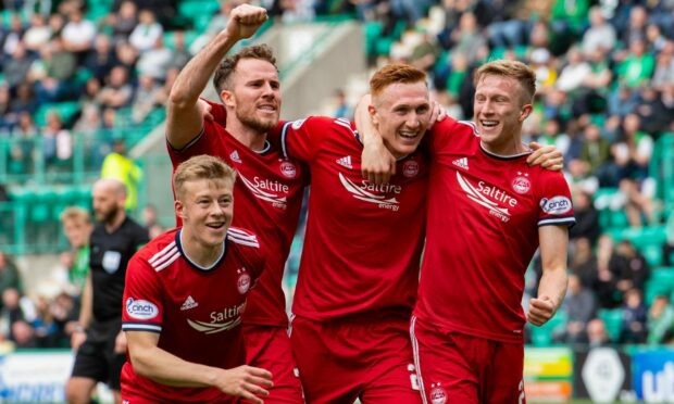 Aberdeen celebrate David Bates' goal against Hibs at Easter Road.