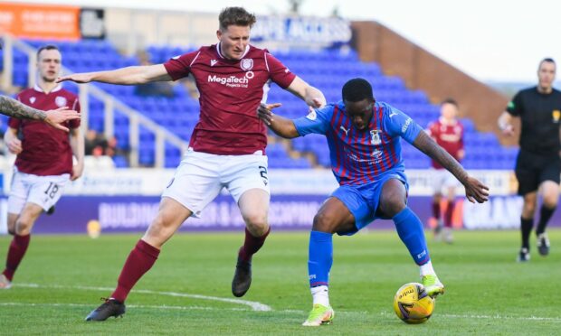 Austin Samuels (right) and Arbroath's Jason Thomson.