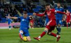 St Johnstone's Dan Cleary blocks an effort from Aberdeen's Liam Harvey during a Premiership match in 2022. Image: SNS.