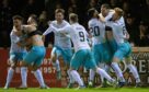 The Inverness players celebrate after Kirk Broadfoot scores the winning penalty during the Premiership Play-Off Semi-Final 2nd Leg match against Arbroath.