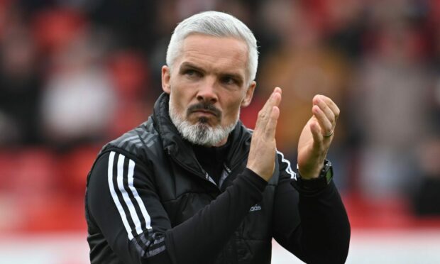 Aberdeen boss Jim Goodwin is scouring Europe for signing targets.