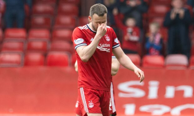 A tearful Andy Considine leaves the pitch in his final match for Aberdeen.