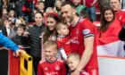 Aberdeen's Andy Considine with wife Madeleine and sons Harry, Teddy and Arthur at full-time after today's 0-0 draw with St Mirren.
