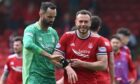 Aberdeen's Joe Lewis gives Andy Considine the captain's armband at full time.