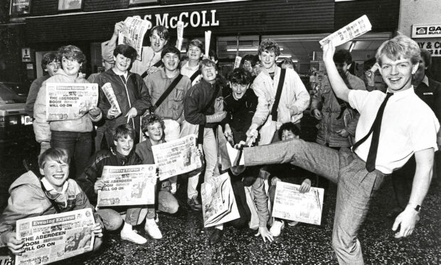 Michael McGunnigle, 20, a grocery supervisor with RS McColl, Bridge of Don, is cheered by the store’s newsboys after his nine-hour disco in Morecambe raised £127 for the appeal.