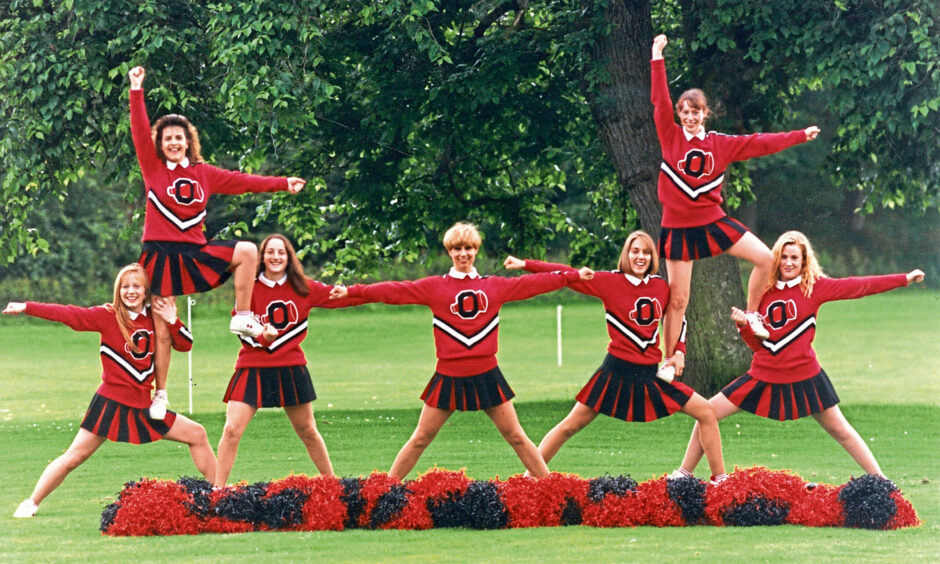 1993 - The Baby Oilers cheerleading squad perform a routine to encourage new members to join the troupe.