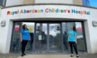 Jill Taylor and Cassie McGunnigle look to the top of Royal Aberdeen Children's Hospital. Supplied by Archie Foundation.