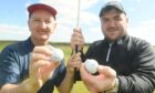 Neil Walker, left, and  Craig Ross who both recorded albatrosses (2 strokes on a par-5) during the same round at Kings Links golf course.