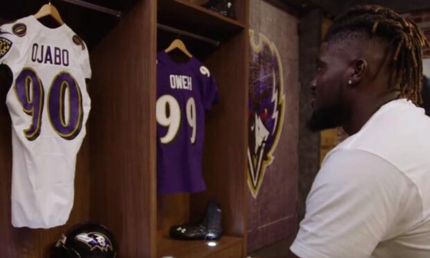 Westhill's David Ojabo seeing his Baltimore Ravens jersey for the first time after being drafted by the NFL team.