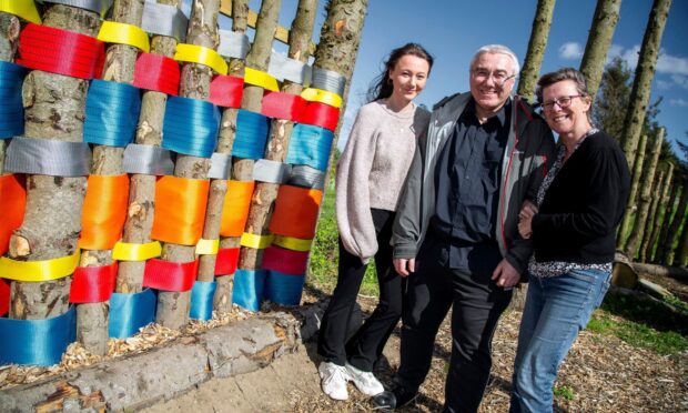 Tom's son Ian Patey (centre), Ian's wife Jennifer (left) and their daughter Megan unveiled the memorial plaque on Thursday. Image by Rory Raitt.