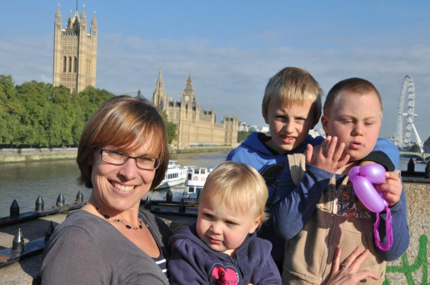 Stephanie and her family, Agnes, Caleb and Adam on a trip to London when he was a young boy.