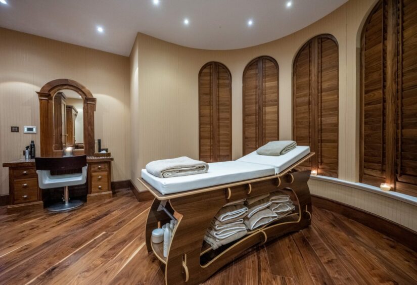 A massage and treatment table in Dalhebity House's beauty salon