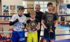 From left - Robert Stewart, Kian Stewart and Jonathan Kamphan, with Inverness City ABC head coach Laurie Redfern.
