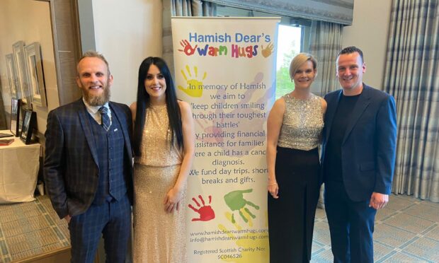 Hollie and Kris Dear with organiser Sarah Shearer and her husband and trustee Neil. Supplied by Hollie Dear.