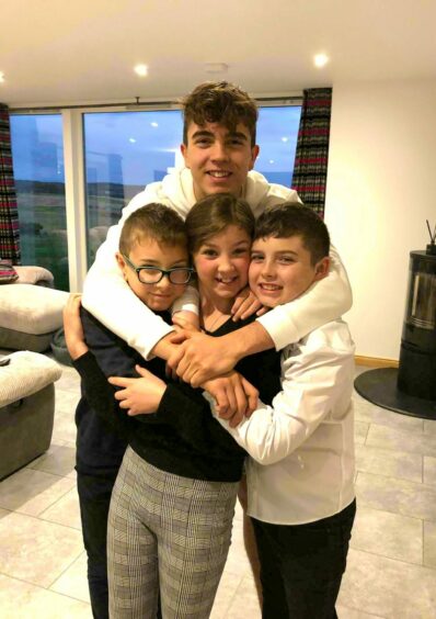 Olivia with her brothers Jack (left), Jamie (back) and Finlay.