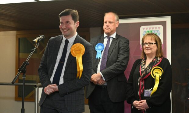 Christopher Price, left, with Buckie councillors Neil McLennan and Sonya Warren. Picture by Jason Hedges/DC Thomson.