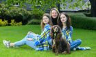 Bohdana (left) and Lizaveta Karlova (right) with Margo Page (owner of Moray fashion firm Great Scot) dressed in the special tartan created in solidarity for Ukraine.
