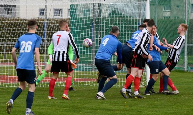 Cameron Bowden (no12) opens the scoring for Bridge of Don Thistle against Dyce.
