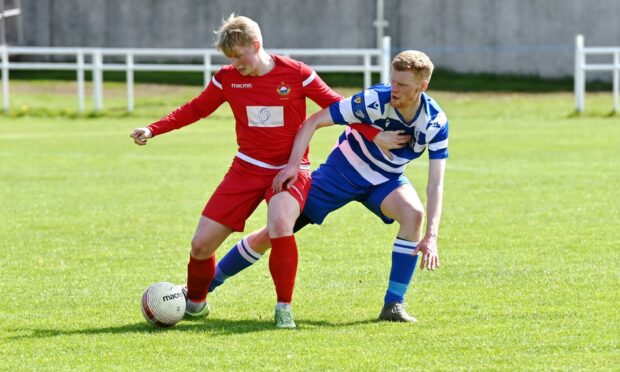 Hall Russell's Sean McHardy and Dyce's Craig Mackie. Picture by Kath Flannery