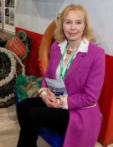 Scottish Fishermen's Federation chief executive Elspeth Macdonald sitting next to fishing gear