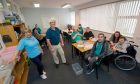 Manager Lind Westbrook and director Alistair Law with the team in the workshop.
Picture by KATH FLANNERY.