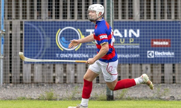 Roddy Young opens the scoring for Kingussie in the Cottages.com MacTavish Cup semi-final played at The Dell.