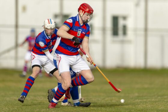 Alexander Michie in action for Kingussie.