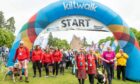 Walkers at the Kiltwalk start line in front of Crathes Castle in 2022