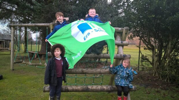 Pupils from Kinlochewe Primary School celebrate their 8th Green Flag. Picture: Kinlochewe Primary School