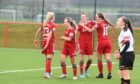 Aberdeen Women players celebrate with Chloe Gover after she opens the scoring against Partick Thistle. Pictures by Paul Glendell