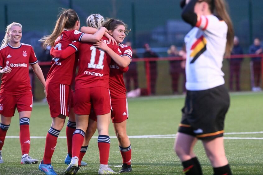 Bailey Collins is congratulated after getting Aberdeen's fourth goal