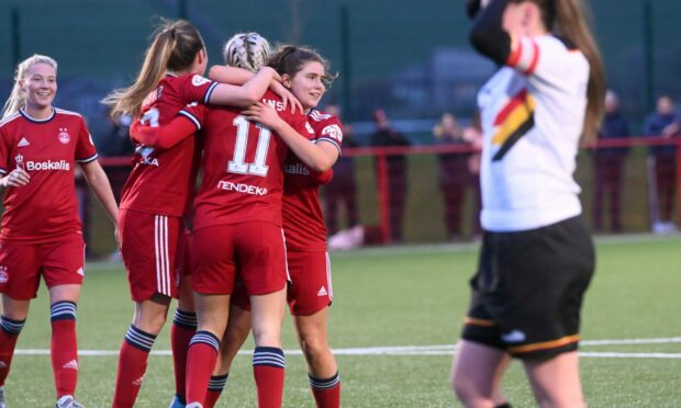 Bailley Collins is congratulated after getting Aberdeen's fourth goal