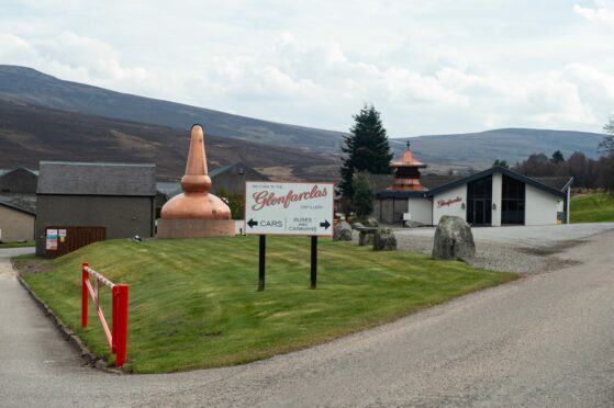 The front door of Glenfarclas Whisky Distillery painted in white and red. Police appeal one year on from when £100K of Glenfarclas whisky was stolen.