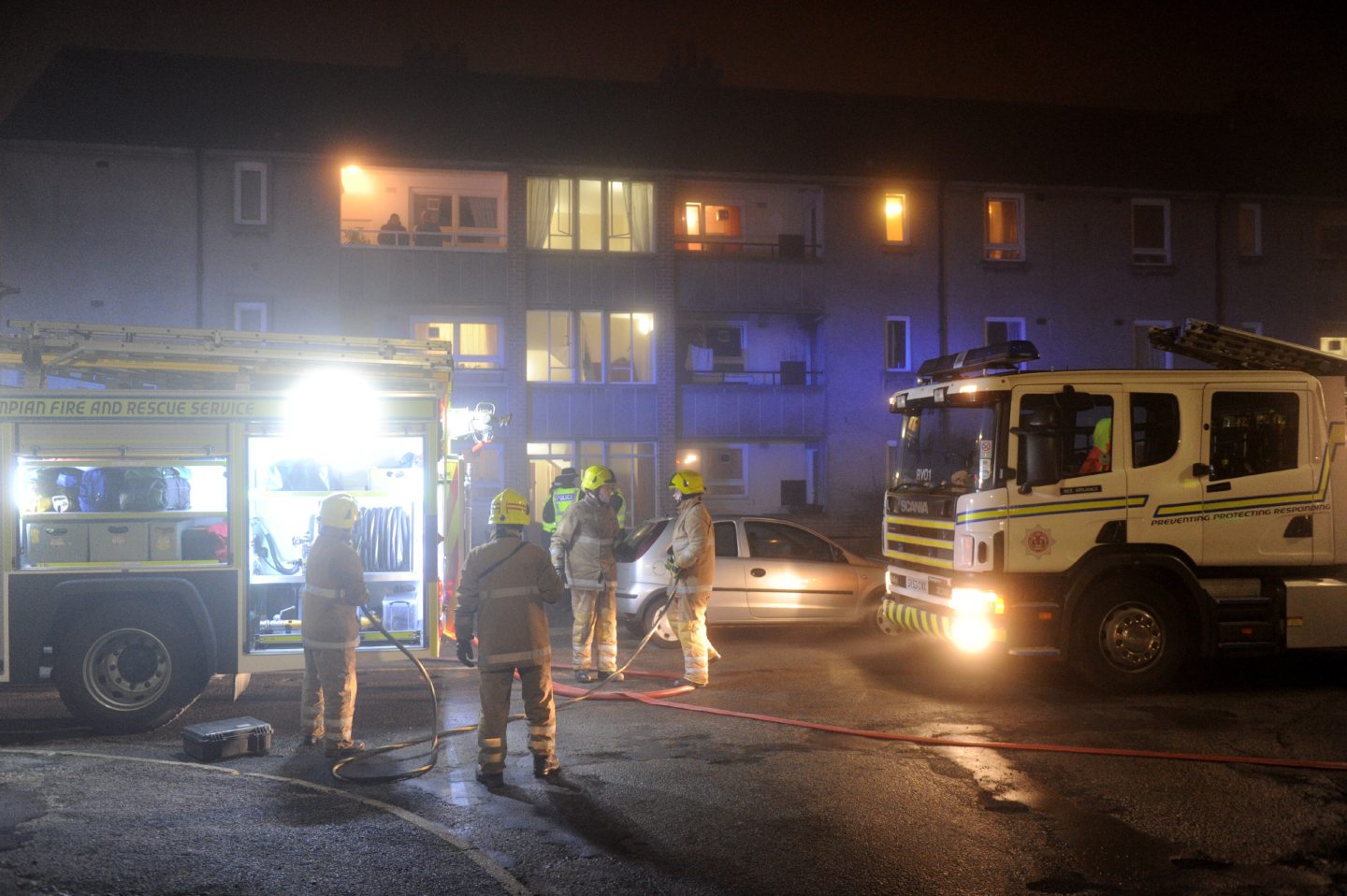 Firefighters at the scene of the flat fire on Arnage Place, Aberdeen.