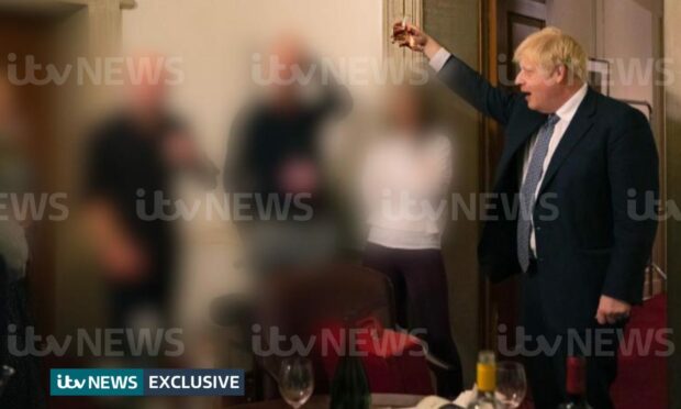 New pictures obtained by ITV News show Boris Johnson next to drinks in the office during the pandemic.