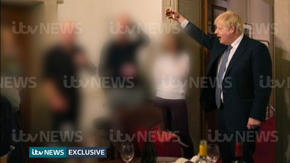 New pictures obtained by ITV News show Boris Johnson next to drinks in the office during the pandemic.
