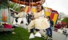 Children enjoy theme park rides at a funfair at Small Heath Park in Birmingham, as the holy month of Ramadan comes to an end and Muslims celebrate Eid al-Fitr. Picture via PA.