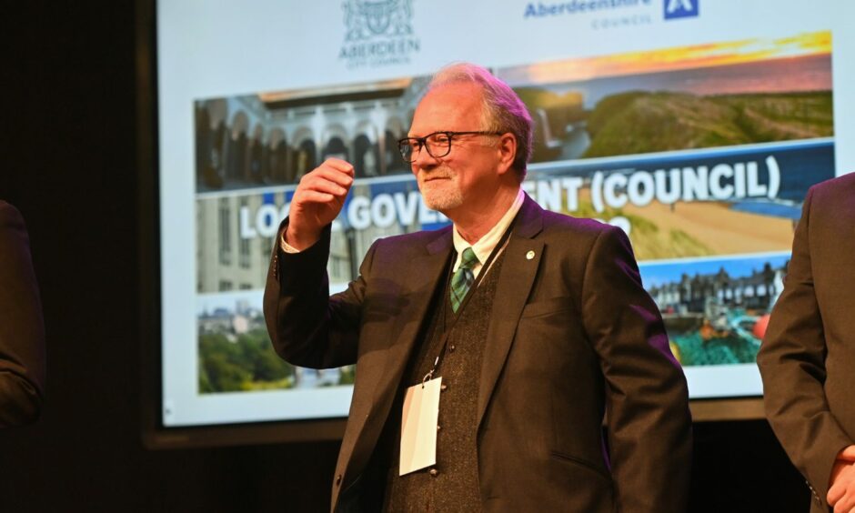 Councillor John Cooke celebrates his re-election. Picture by Scott Baxter.