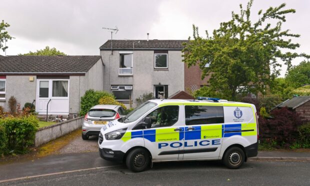 Police outside the home in Inverurie. Photo: Scott Baxter/DCT Media