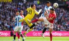 Nottingham Forest's Scott McKenna (right) attempts to head the ball from pressure during the Sky Bet Championship play-off final at Wembley
