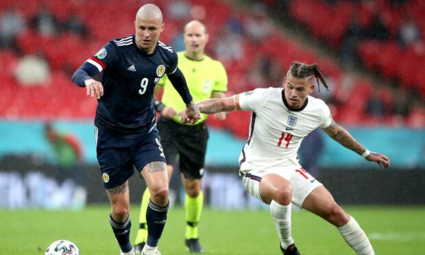 Scotland's Lyndon Dykes , left, and England's Kalvin Phillips at the Euros.