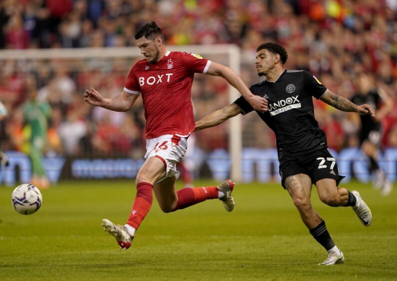 Nottingham Forest's Scott McKenna battles for the ball with Sheffield United's Morgan Gibbs-White during the Sky Bet Championship play-off semi-final