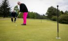 SDGC chair Jim Gales, who is registered blind, plays gof, assisted by coach and guide Martin Lowe at Ladybank Golf Club. Picture by Steve Brown / DC Thomson
