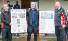 From left - Glen Urquhart vice-chairman Andrew Lloyd, project creator Eoghan Stewart, and Jim Barr, trustee of Glen Urquhart SC with information boards from The Garg Project after the recent Macdonald Cup clash.