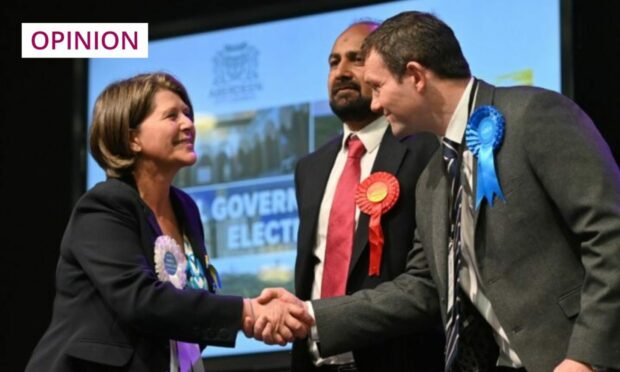 Candidates shake hands during the recent Scottish local elections (Photo: Scott Baxter/DC Thomson)