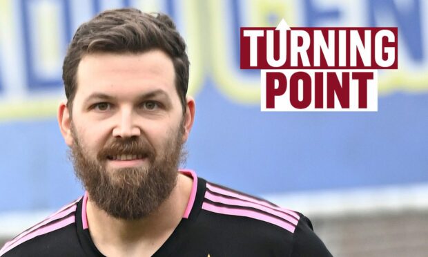 Chris Sumner smiling with the 'Turning Point' logo next to him