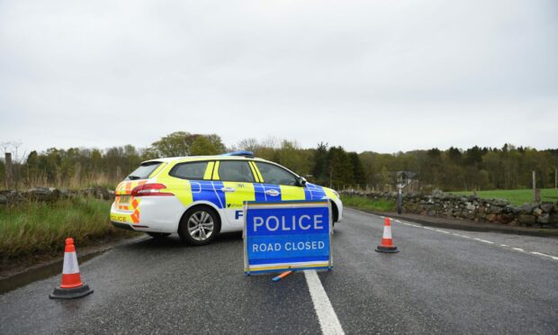 Police have closed off the B9077 road in both directions following a three-vehicle crash near Ardoe. Picture by Wullie Marr.