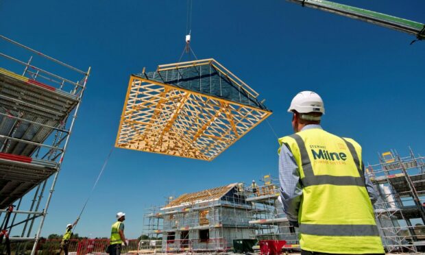 Construction stock workers on a project of housebuilder Stewart Milne.