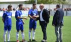 Alex McLeish meets Cove Rangers players at the opening of the Balmoral Stadium in 2018