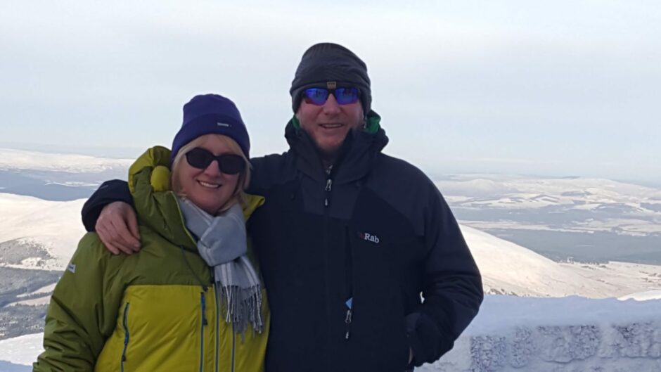 William and Gillian McHaffie on top of snowy mountain